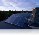 30 Stiebel 4x7 flat plate collectors oriented for summertime production connected to a 2000 gallon pre heat tank covering 50% of the domestic load for a 75 room hotel